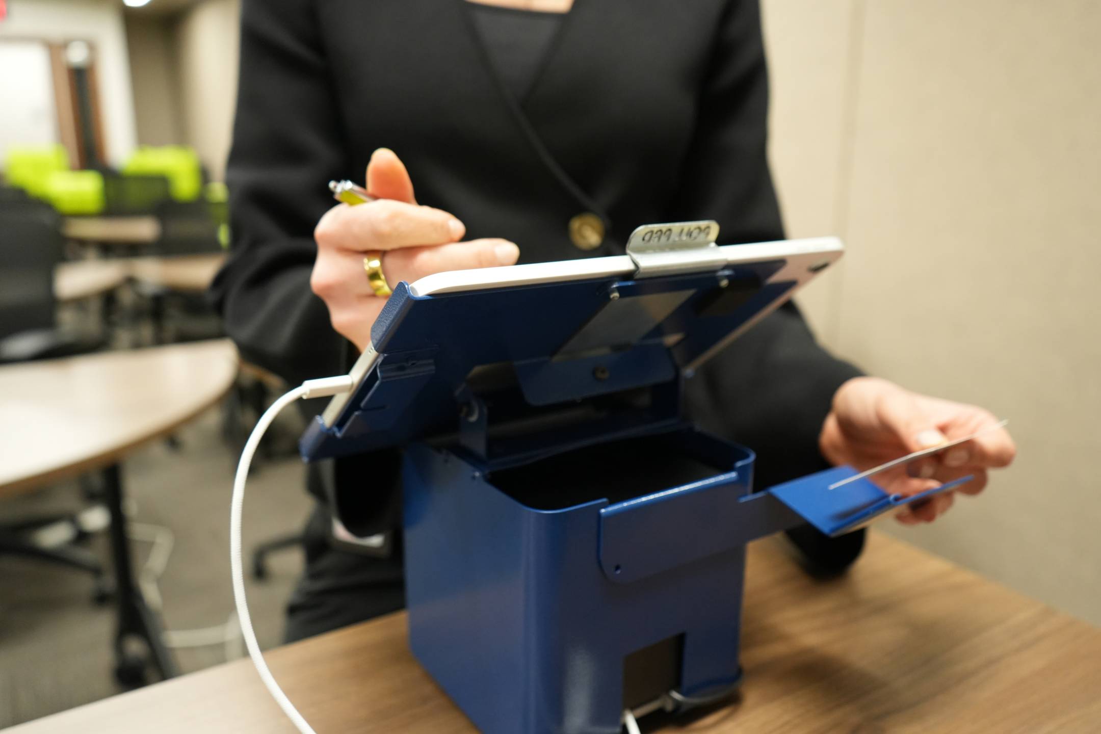 Picture of voter checking in on a PollPad.